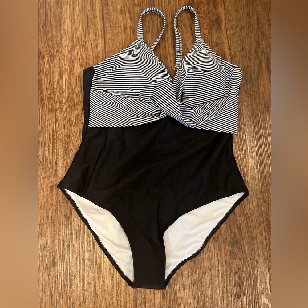 One piece black and white bathing suit.